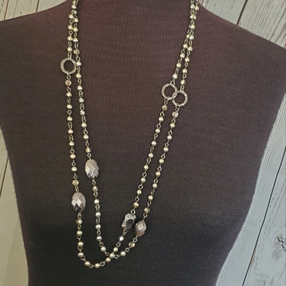 Silvertone and black bead and geometric stations necklace